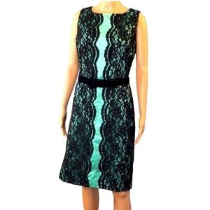 Bentley A. Dress size 10 vintage sheath light green satin with black lace.​